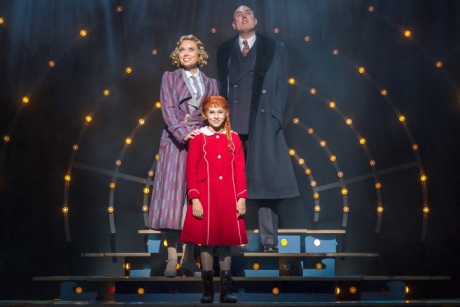 Holly Dale Spencer Grace Farrell, Ruby Stokes Annie and Alex Bourne Daddy Warbucks in Annie at the Piccadilly Theatre  Photo credit Paul Coltas